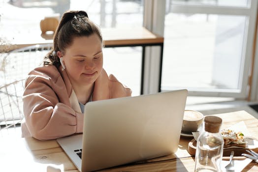 young adult with laptop