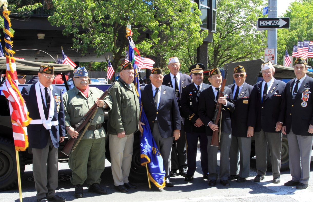 older veterans of various military branches lined up for a photo