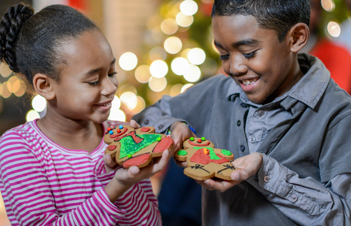 boy and girl smiling at christmas cookies