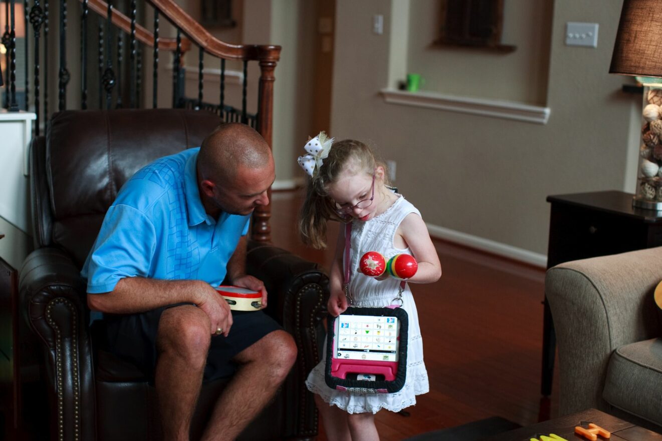 dad and daughter playing instruments