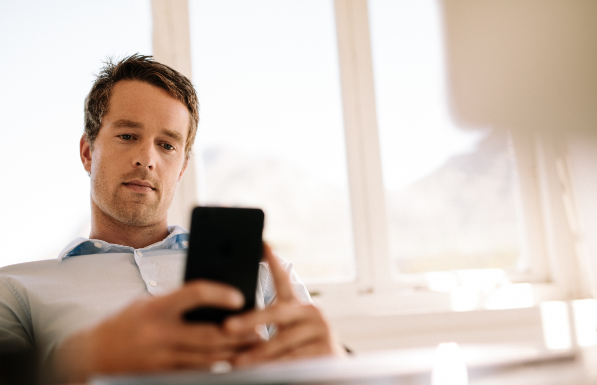 man looking at phone