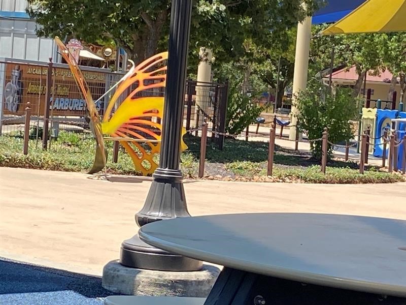 Bench in the shape of a yellow and orange butterfly