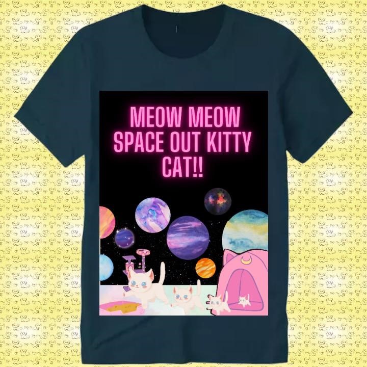 Dark gray T-shirt reading "Meow Meow Space Out Kitty Cat!!" with image depicting white cat, followed by three kittens, emerging from pink tent against background displaying a dark sky and colorful planets.