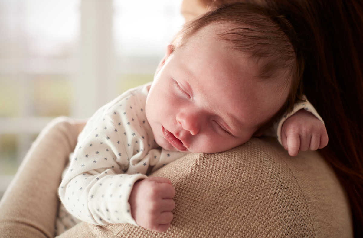baby sleeping on shoulder