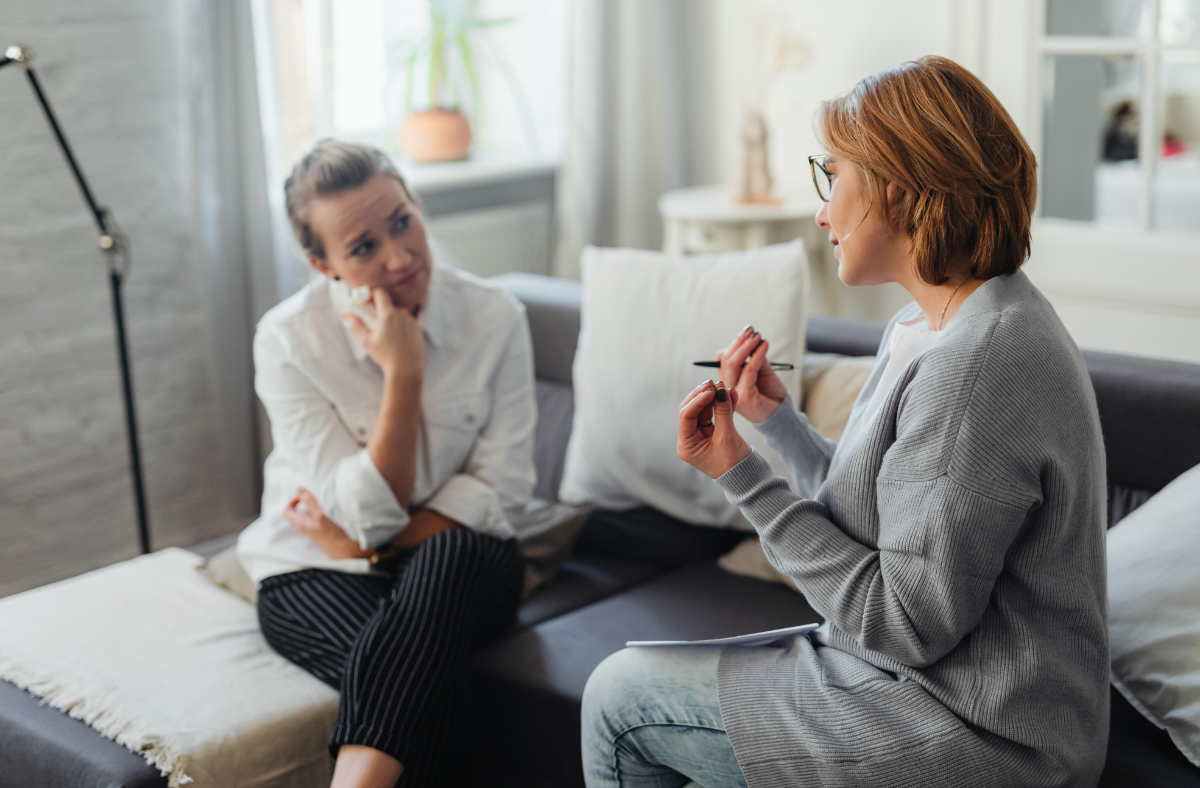 patient advocate sitting and talking with patient