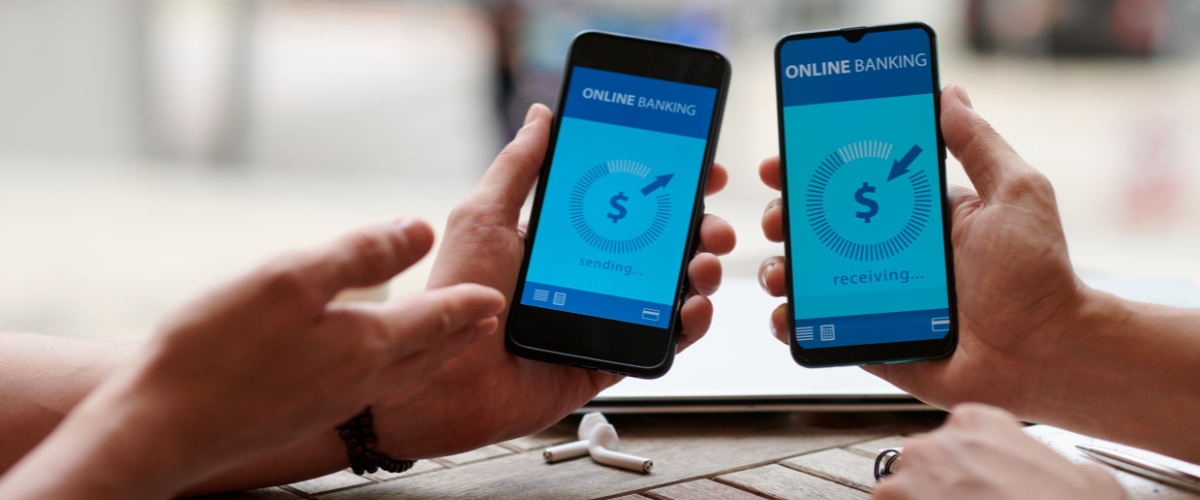 2 hands holding phones with mock bank app on screen
