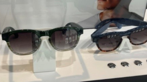 2 pairs of AI glasses sitting on display counter