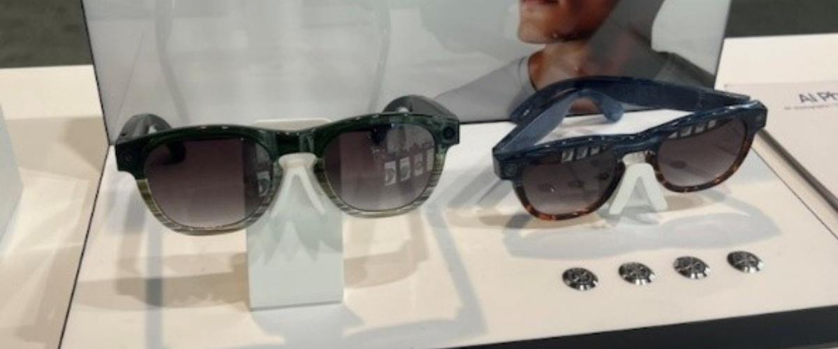 2 pairs of AI glasses sitting on display counter