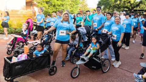 large group of individuals at the starting line of a walk event