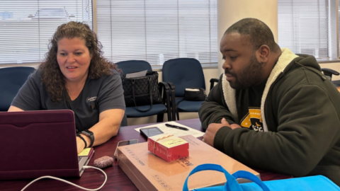 lady and man in lab looking at laptop