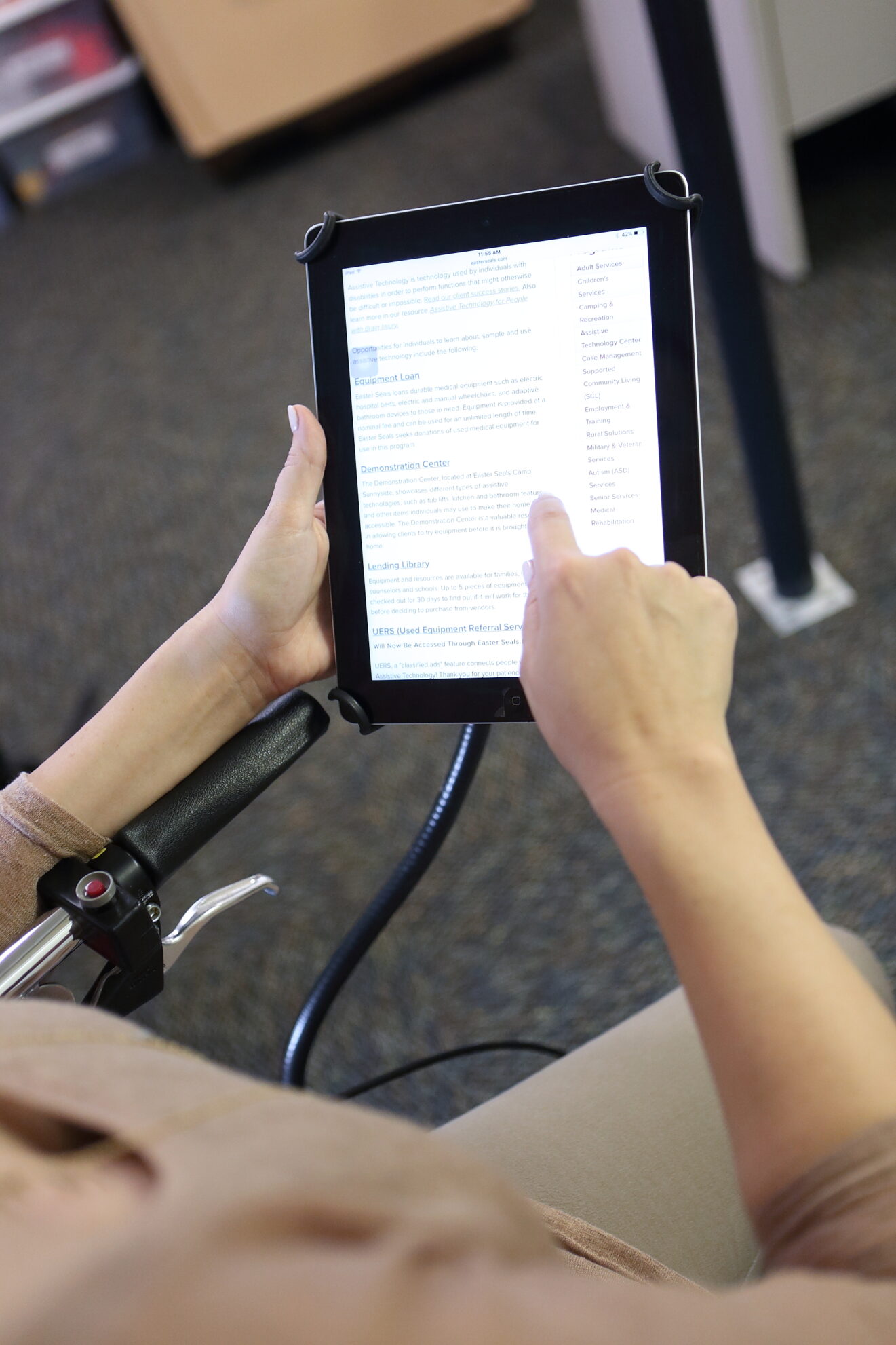 hand typing on ipad