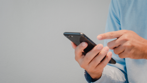close up of hands holding phone