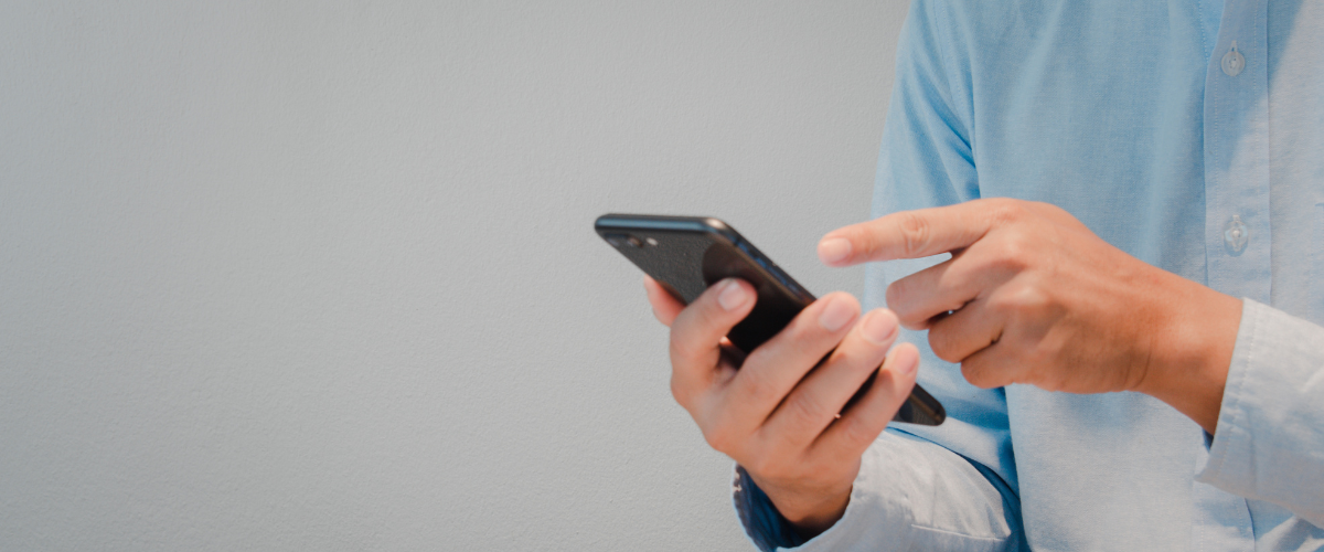 close up of hands holding phone