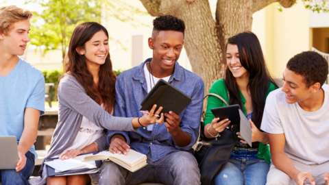 young adults w notebooks laptops devices