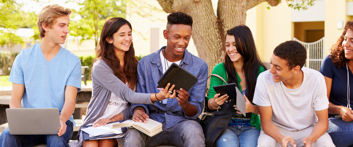 young adults w notebooks laptops devices
