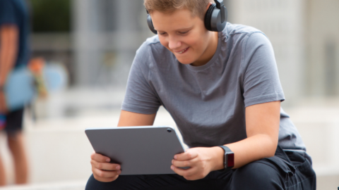 young man looking at ipad