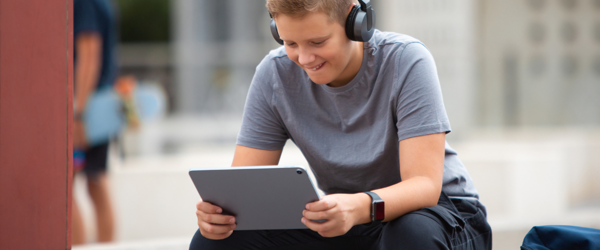 young man looking at ipad